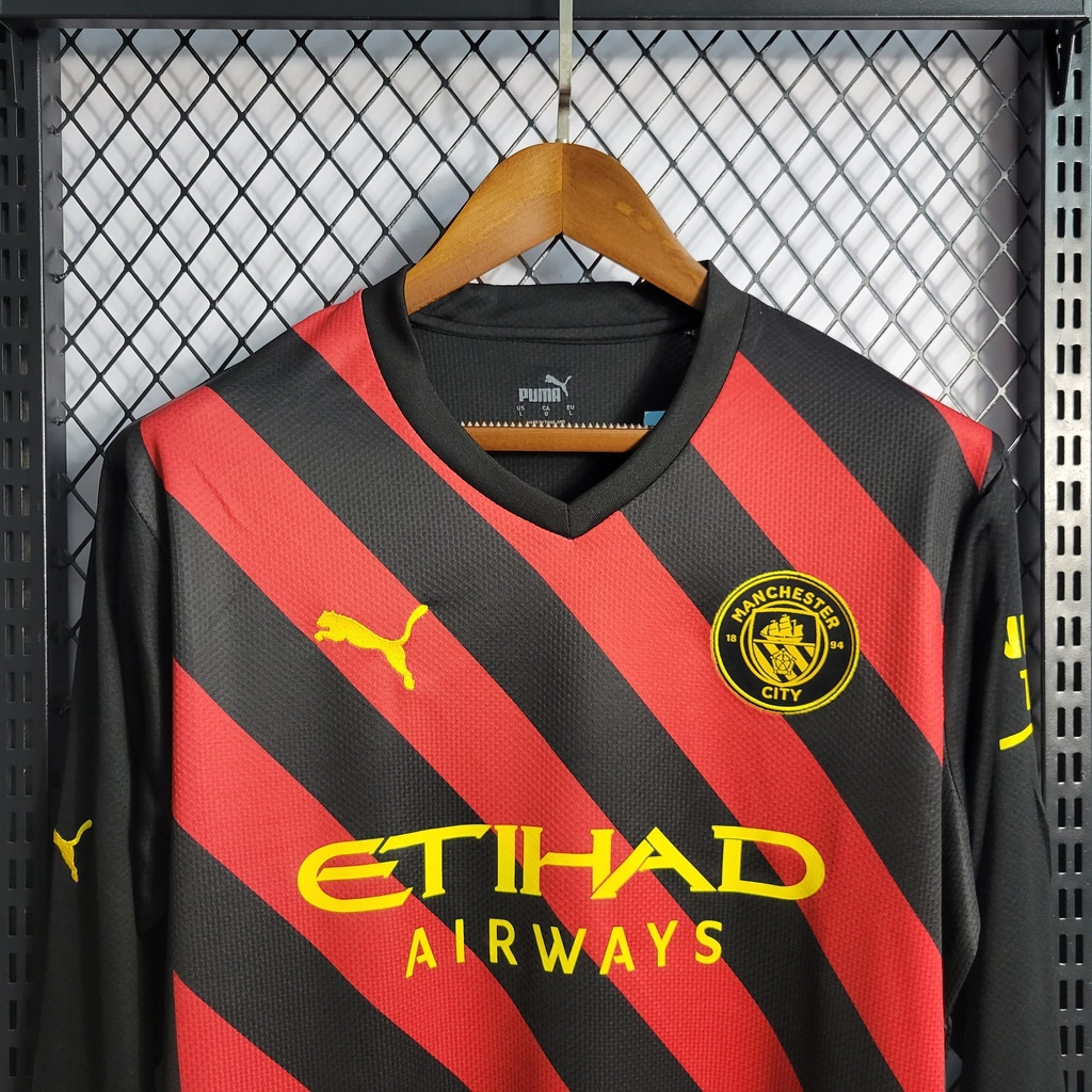 Camisa do Manchester City Manga Longa 2022-2023 Camisa do Manchester City Manga Longa 2022-2023