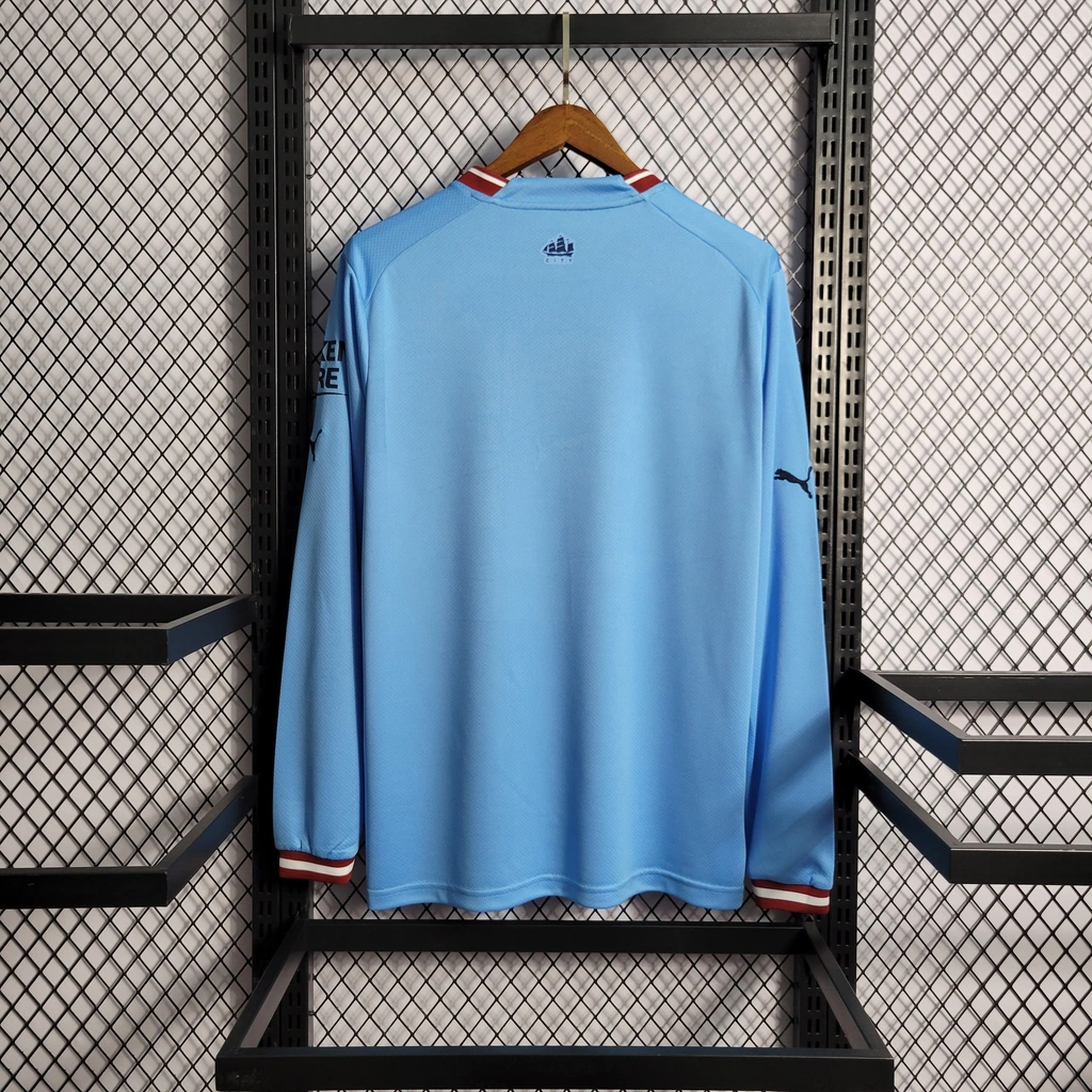 Camisa do Manchester City Manga Longa 2022-2023 Camisa do Manchester City Manga Longa 2022-2023