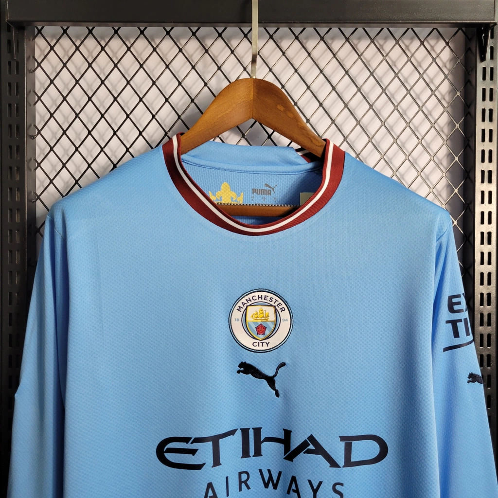 Camisa do Manchester City Manga Longa 2022-2023 Camisa do Manchester City Manga Longa 2022-2023